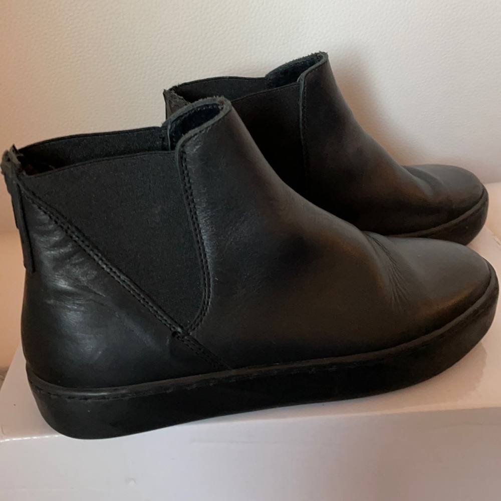 Black flat booties.